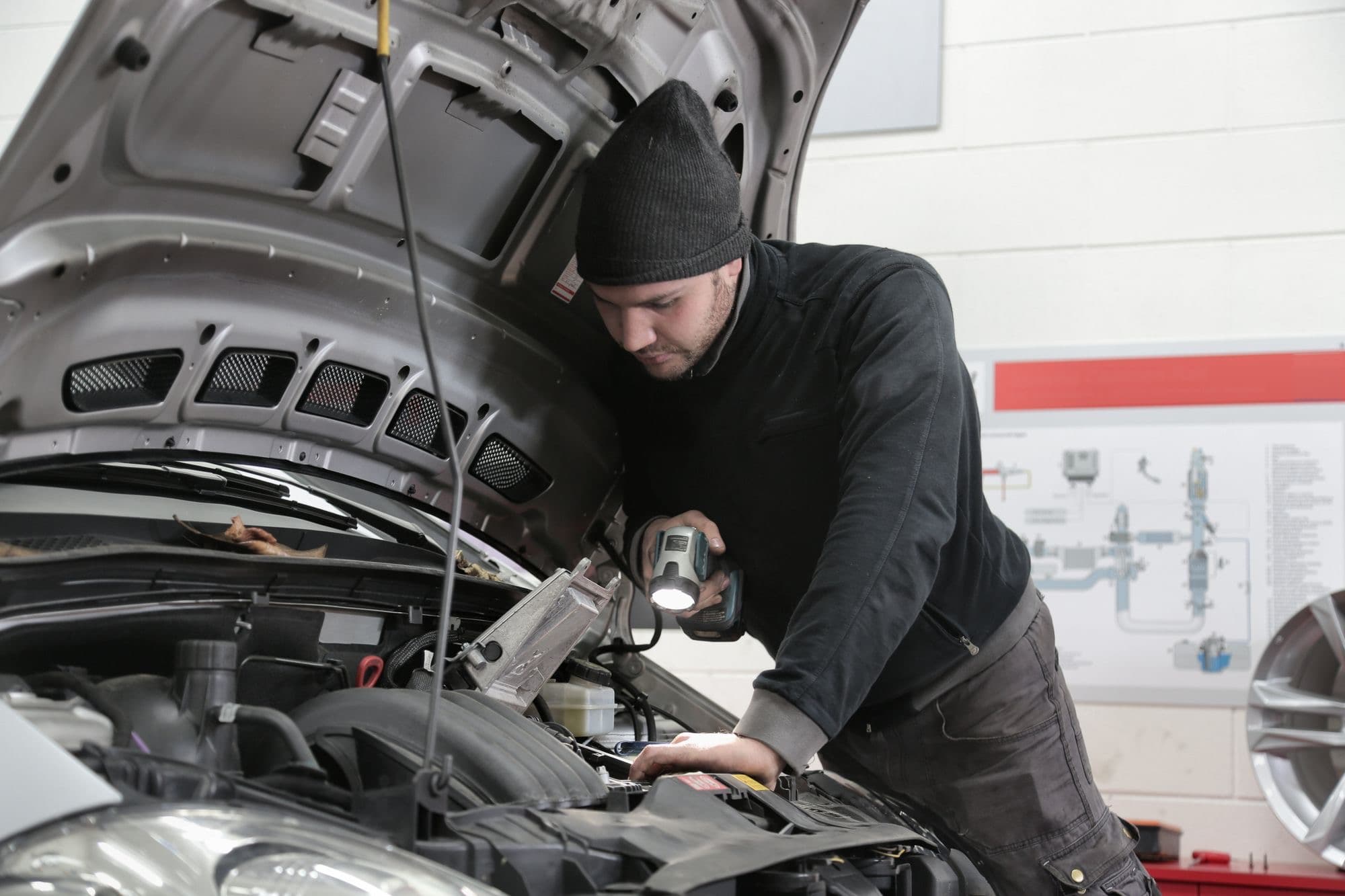 Technician checking a car tyre in the Nova Tyres workshop