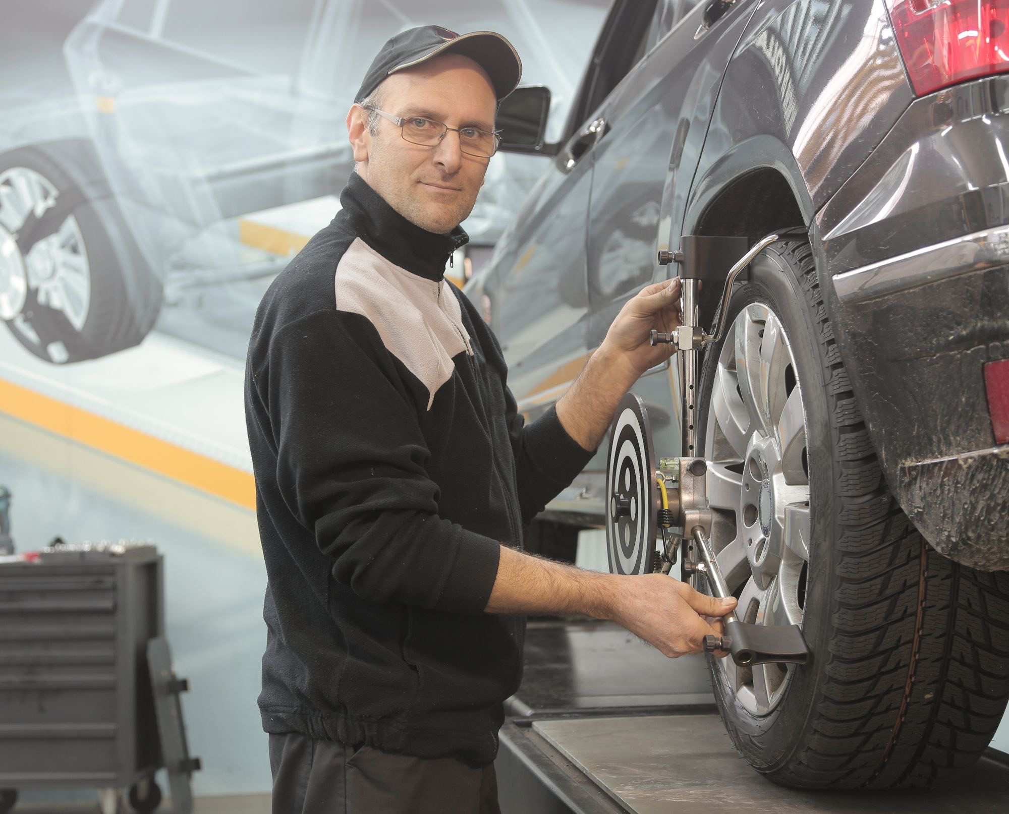 Wheel alignment sensors fitted to a car
