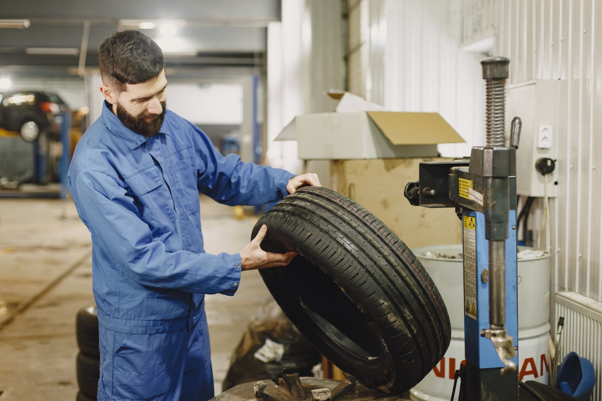 Tyre being fitted and inflated in the workshop